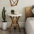 Table d'appoint ronde COZAYH, style ferme moderne, plateau vieilli et piètement assorti. Idéale pour une déco bohème ou une maison de campagne moderne.