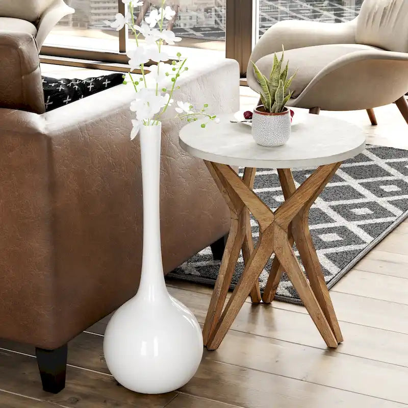 Table d'appoint ronde COZAYH, style ferme moderne, plateau vieilli et piètement assorti. Idéale pour une déco bohème ou une maison de campagne moderne.