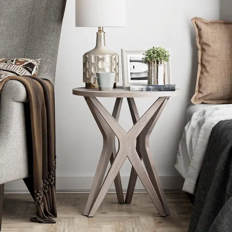 Table d'appoint ronde COZAYH, style ferme moderne, plateau vieilli et piètement assorti. Idéale pour une déco bohème ou une maison de campagne moderne.