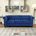 Canapé Chesterfield Morden Fort en velours, orné de clous décoratifs et doté de pieds massifs, pour salon