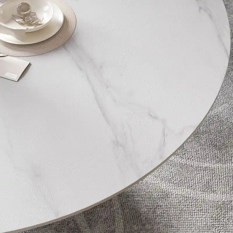Table de salle à manger ronde blanche moderne, plateau en pierre frittée, piètement en acier au carbone noir massif