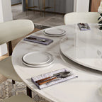 Table de salle à manger ronde blanche moderne, plateau en pierre frittée, piètement en acier au carbone noir massif