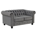 Canapé Chesterfield deux places Morden Fort en velours, capitonné, clouté et pieds massifs, idéal pour le salon.