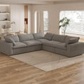Grand canapé d'angle rembourré de duvet avec pouf pour salon