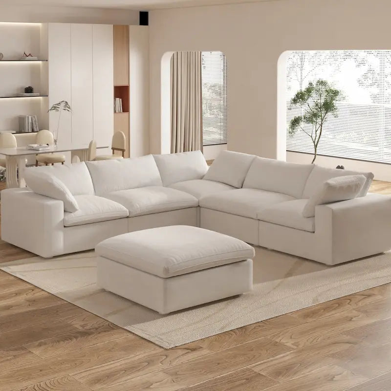 Grand canapé d'angle rembourré de duvet avec pouf pour salon