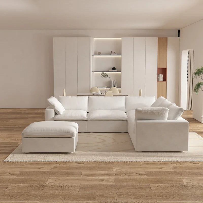 Grand canapé d'angle rembourré de duvet avec pouf pour salon