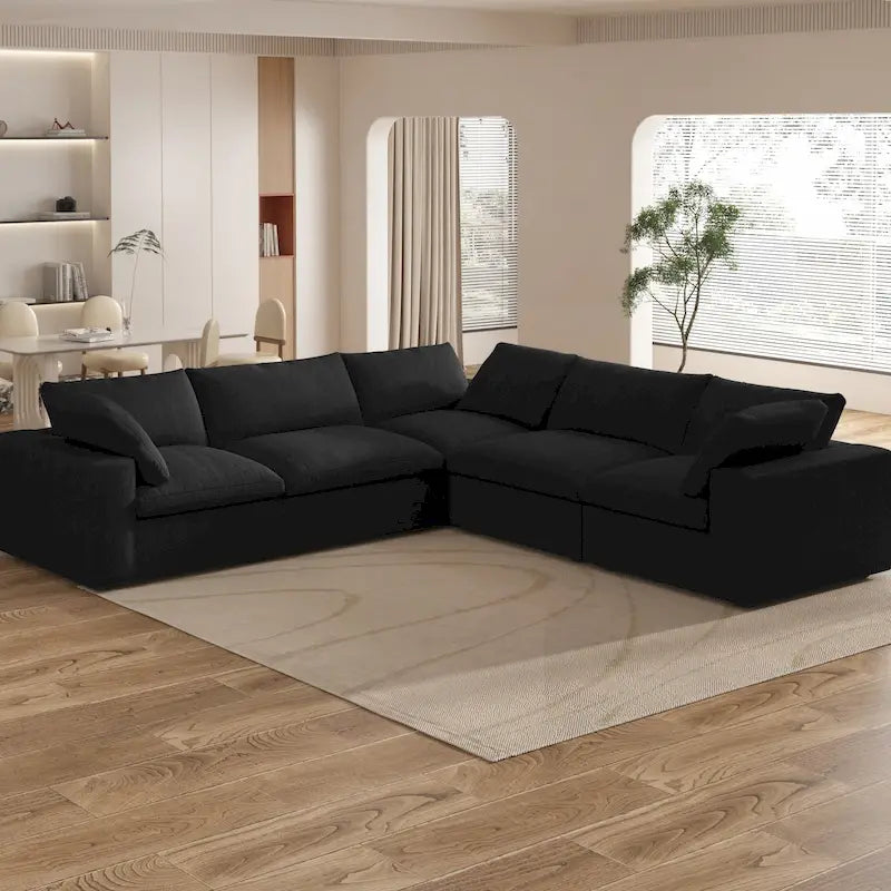 Grand canapé d'angle rembourré de duvet avec pouf pour salon