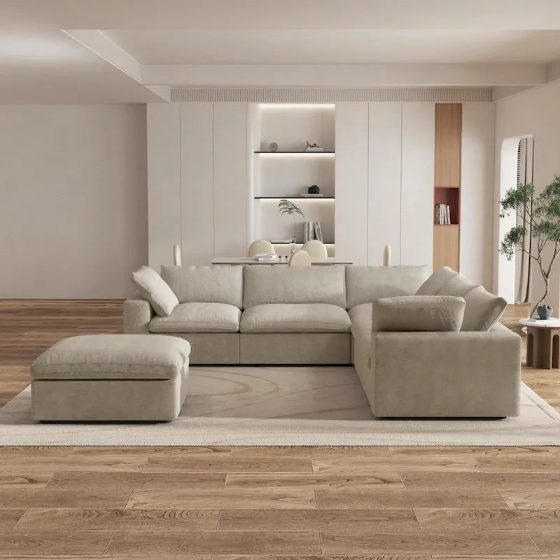 Grand canapé d'angle rembourré de duvet avec pouf pour salon