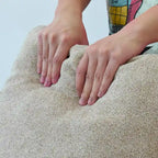 Grand canapé d'angle rembourré de duvet avec pouf pour salon