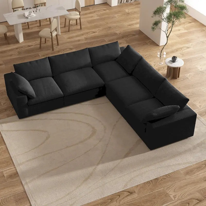 Grand canapé d'angle rembourré de duvet avec pouf pour salon