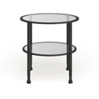 Table d'appoint ronde Glenn de SEI Furniture, en métal noir vieilli, avec plateau en verre et étagère.