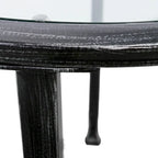 Table d'appoint ronde Glenn de SEI Furniture, en métal noir vieilli, avec plateau en verre et étagère.