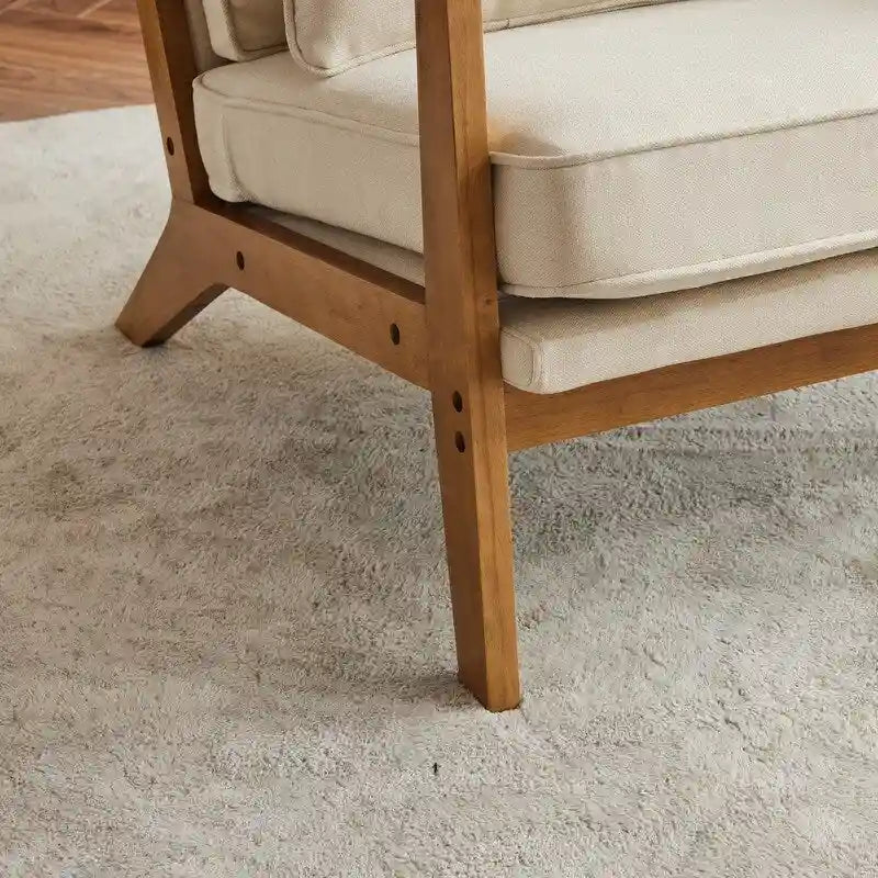 Fauteuil d'appoint beige en lin mélangé, pieds en bois et un coussin.