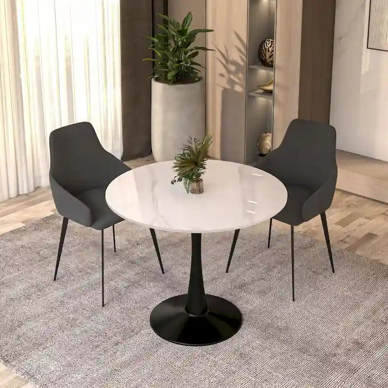 Table de salle à manger ronde Bristol 35 pour 4 personnes avec plateau en pierre frittée et piètement noir, idéale pour la cuisine et la salle à manger.
