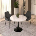 Table de salle à manger ronde Bristol 35 pour 4 personnes avec plateau en pierre frittée et piètement noir, idéale pour la cuisine et la salle à manger.